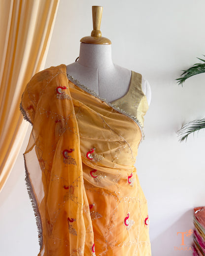 Soft georgette saree featuring elephant motifs and decorative lace border