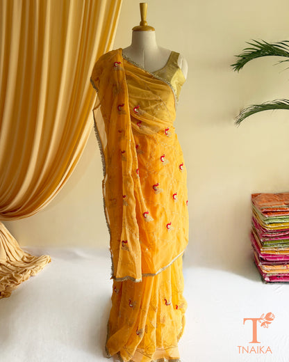 Festive georgette saree with heritage inspired embroidery and flowing drape