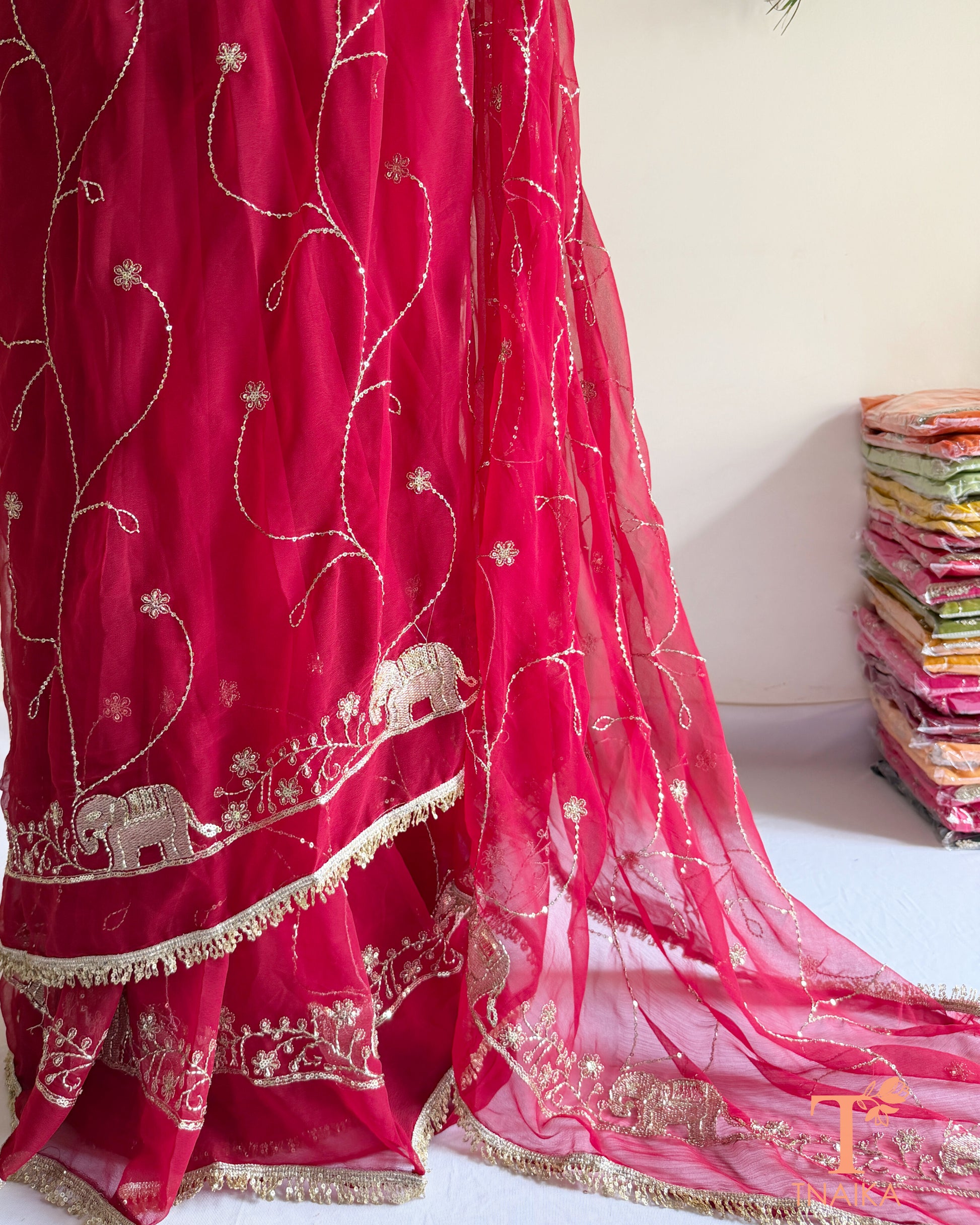 Soft georgette saree featuring elephant motifs and decorative lace border