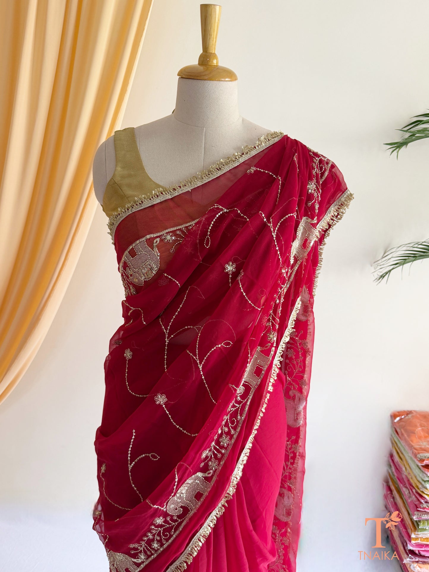 Rajputi style georgette saree with fine cut dana embroidery and elephant motif border