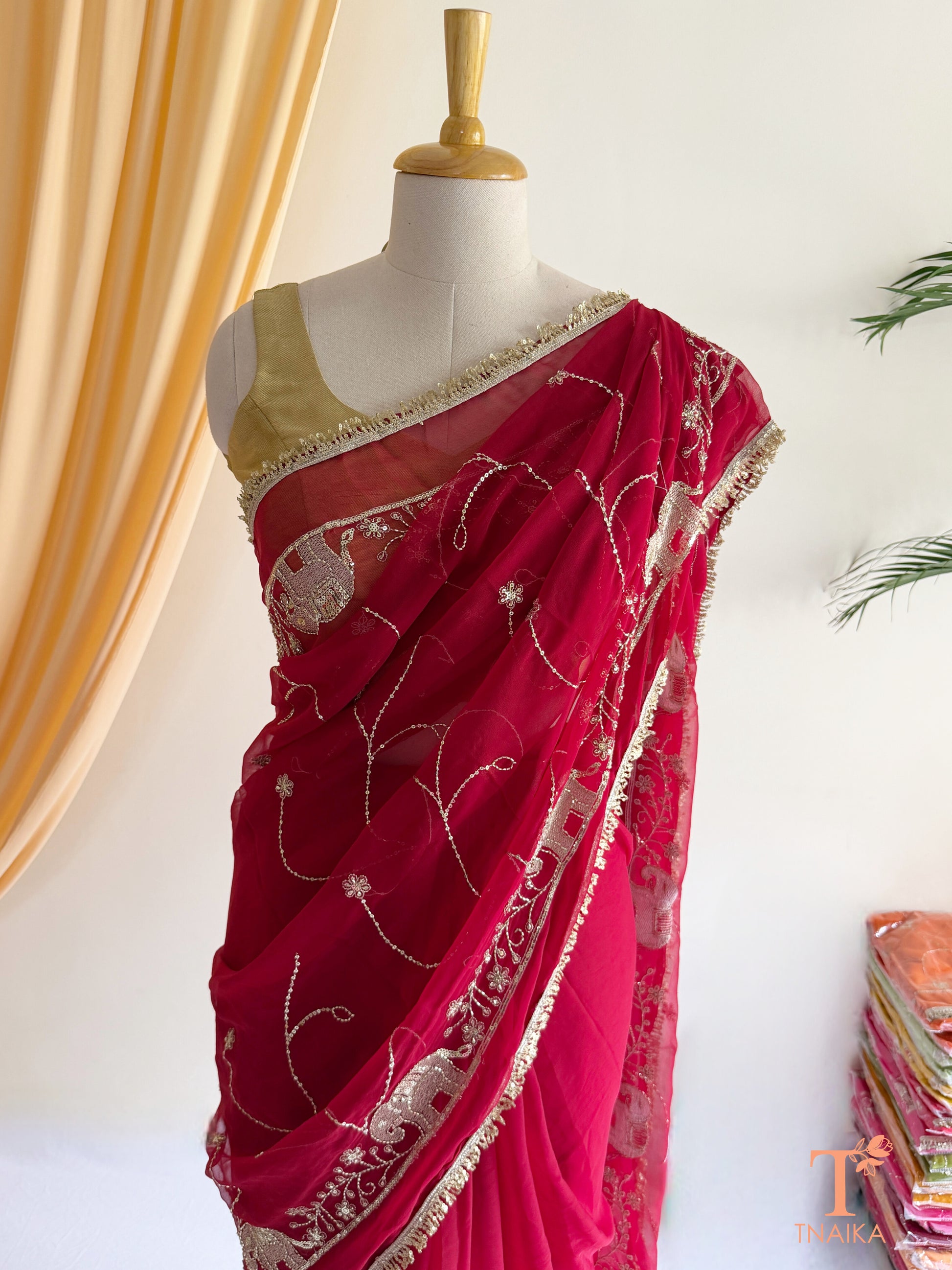 Rajputi style georgette saree with fine cut dana embroidery and elephant motif border