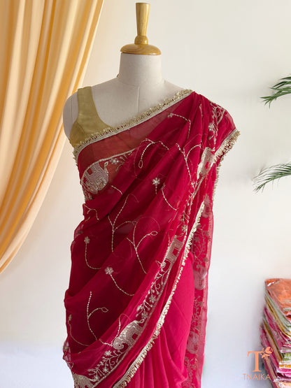 Rajputi style georgette saree with fine cut dana embroidery and elephant motif border