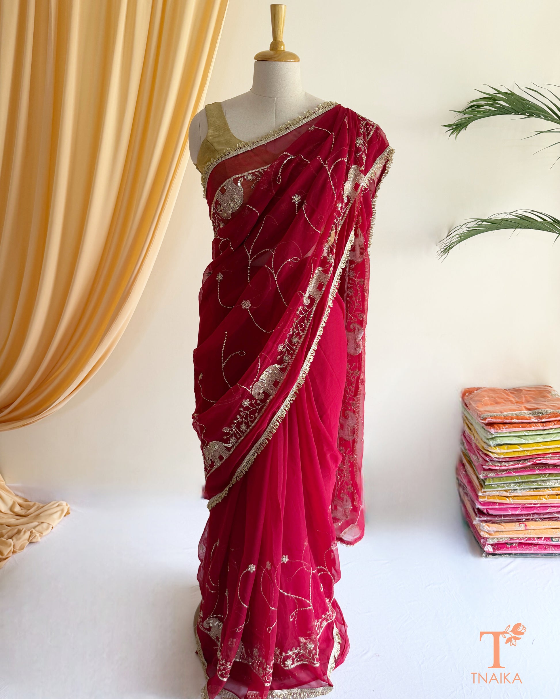 Designer georgette saree with intricate cut dana embroidery and elegant border