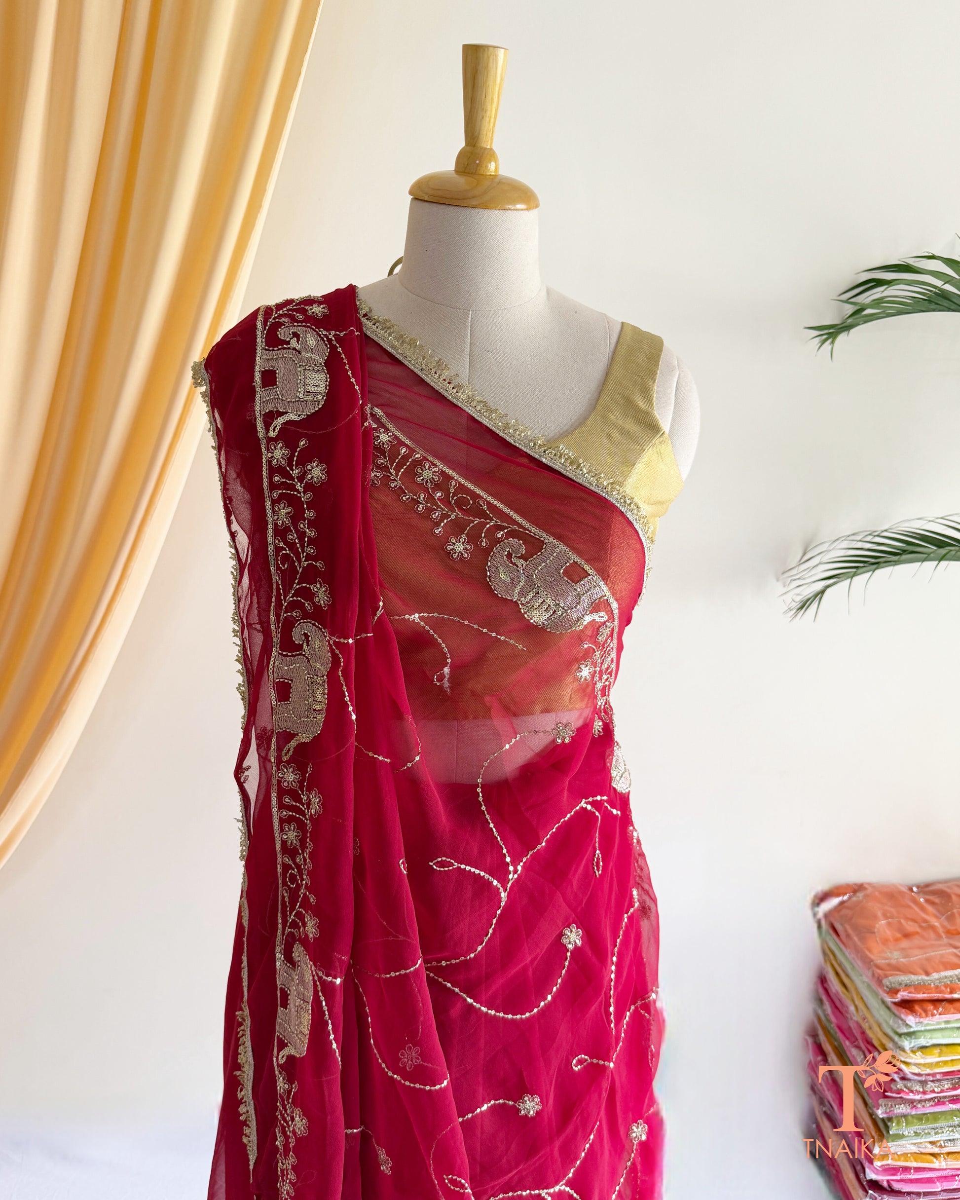 Lightweight georgette saree featuring embroidered elephant border and lace detailing