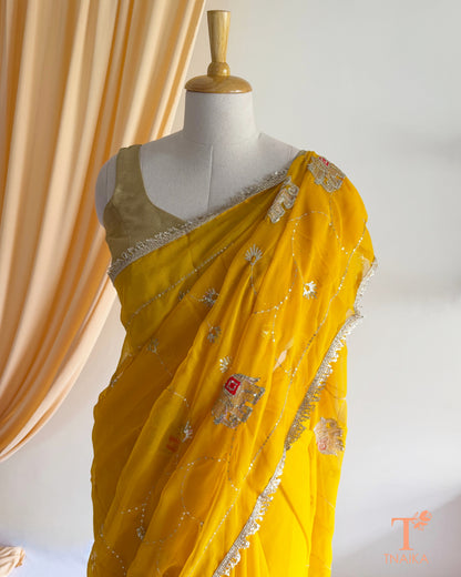 Elegant georgette saree featuring embroidered vine patterns