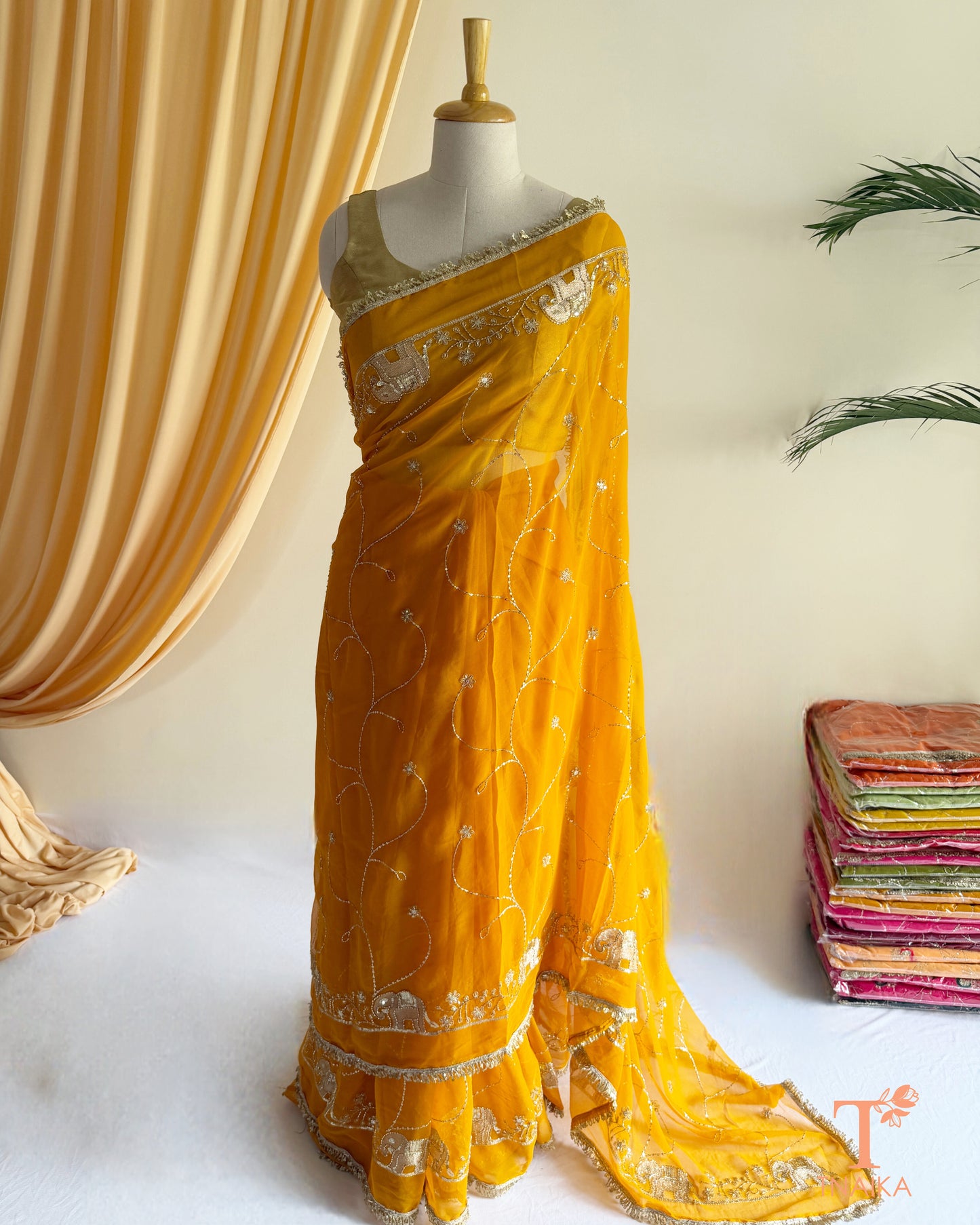 Lightweight georgette saree featuring embroidered elephant border and lace detailing