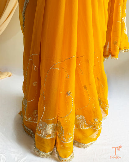 Festive georgette saree with heritage inspired embroidery and flowing drape