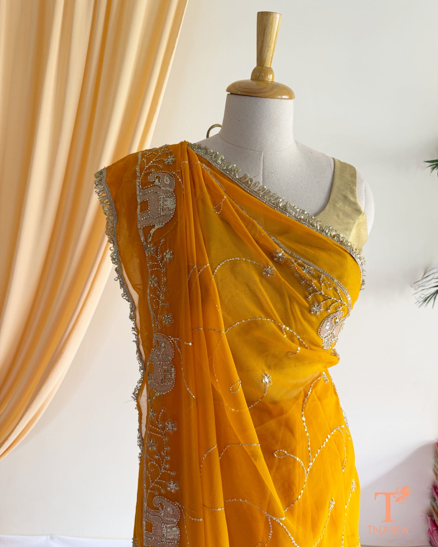 Rajputi style georgette saree with fine cut dana embroidery and elephant motif border