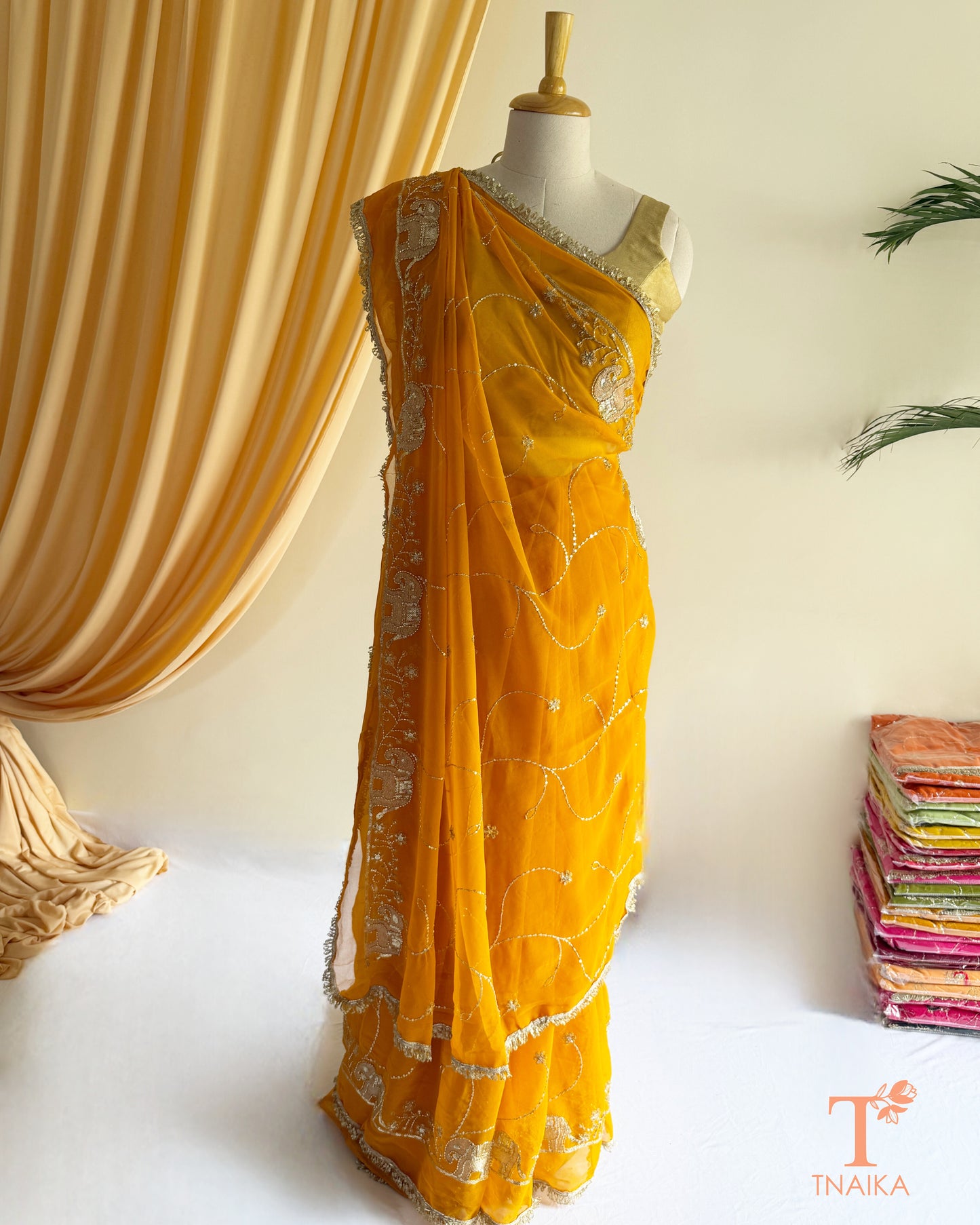 Soft georgette saree featuring elephant motifs and decorative lace border