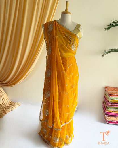 Soft georgette saree featuring elephant motifs and decorative lace border