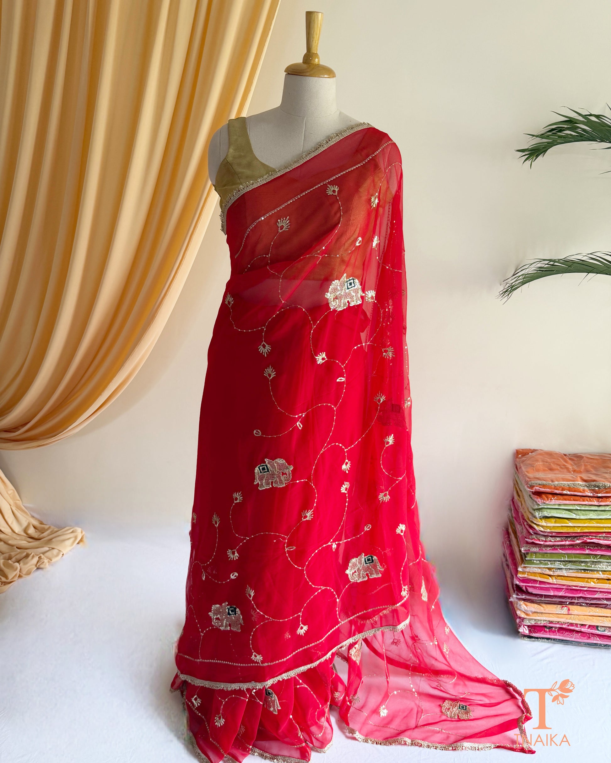 Elegant georgette saree featuring embroidered vine patterns