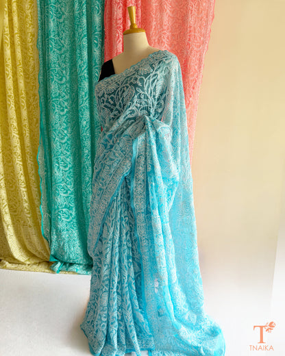 Premium Lucknowi Chikankari saree featuring delicate hand embroidery.