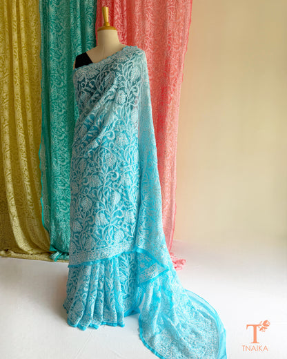 Handcrafted Chikankari saree with intricate Lucknowi embroidery and elegant drape.