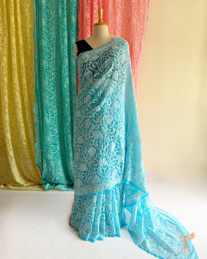 Traditional Chikankari saree with detailed floral embroidery and graceful finish.