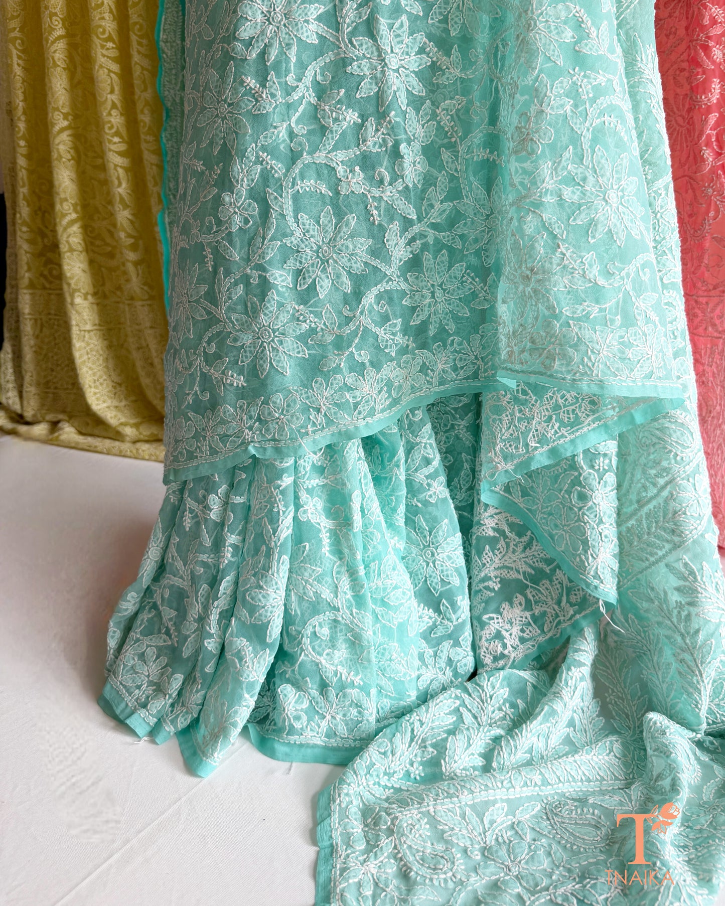 Handcrafted Chikankari saree with intricate Lucknowi embroidery and elegant drape.