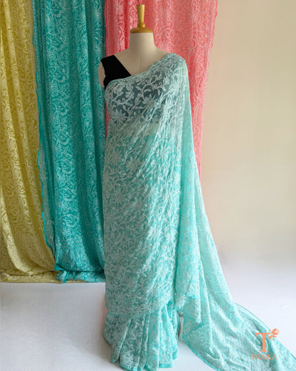 Traditional Chikankari saree with detailed floral embroidery and graceful finish.