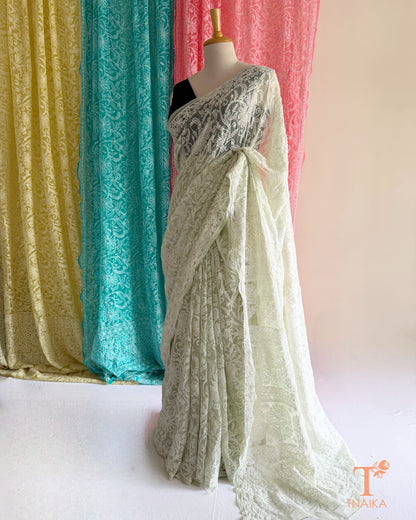 Premium Lucknowi Chikankari saree featuring delicate hand embroidery.