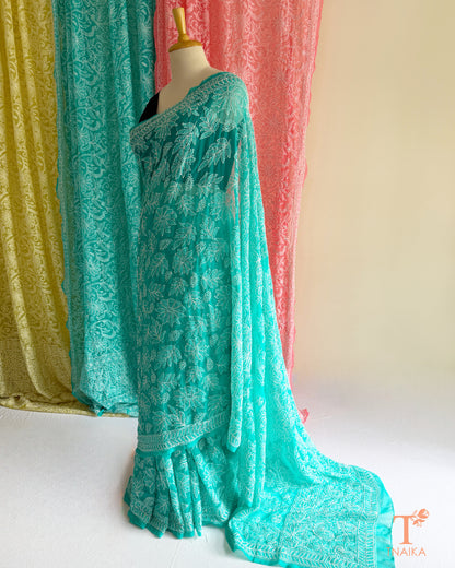 Premium Chikankari full jaal saree featuring dense traditional embroidery.