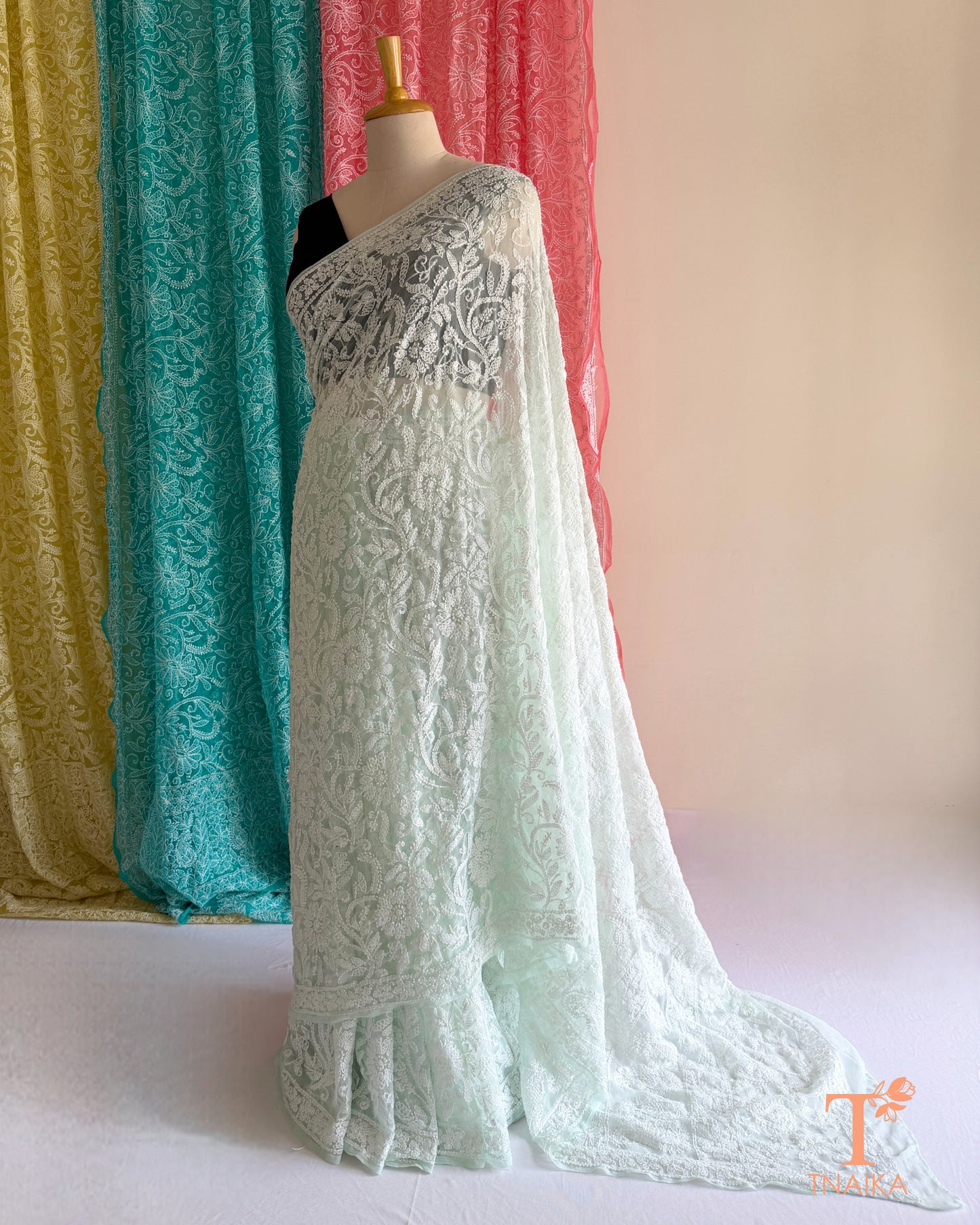 Lightweight full jaal Chikankari saree with intricate floral embroidery.