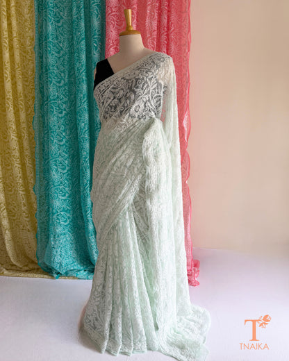 Premium Chikankari full jaal saree featuring dense traditional embroidery.