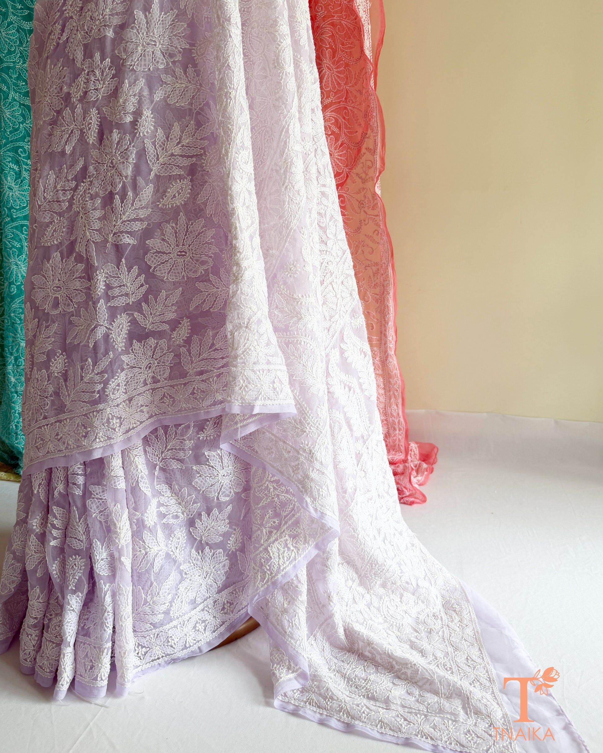Full jaal Chikankari saree with intricate Lucknowi embroidery on soft fabric.