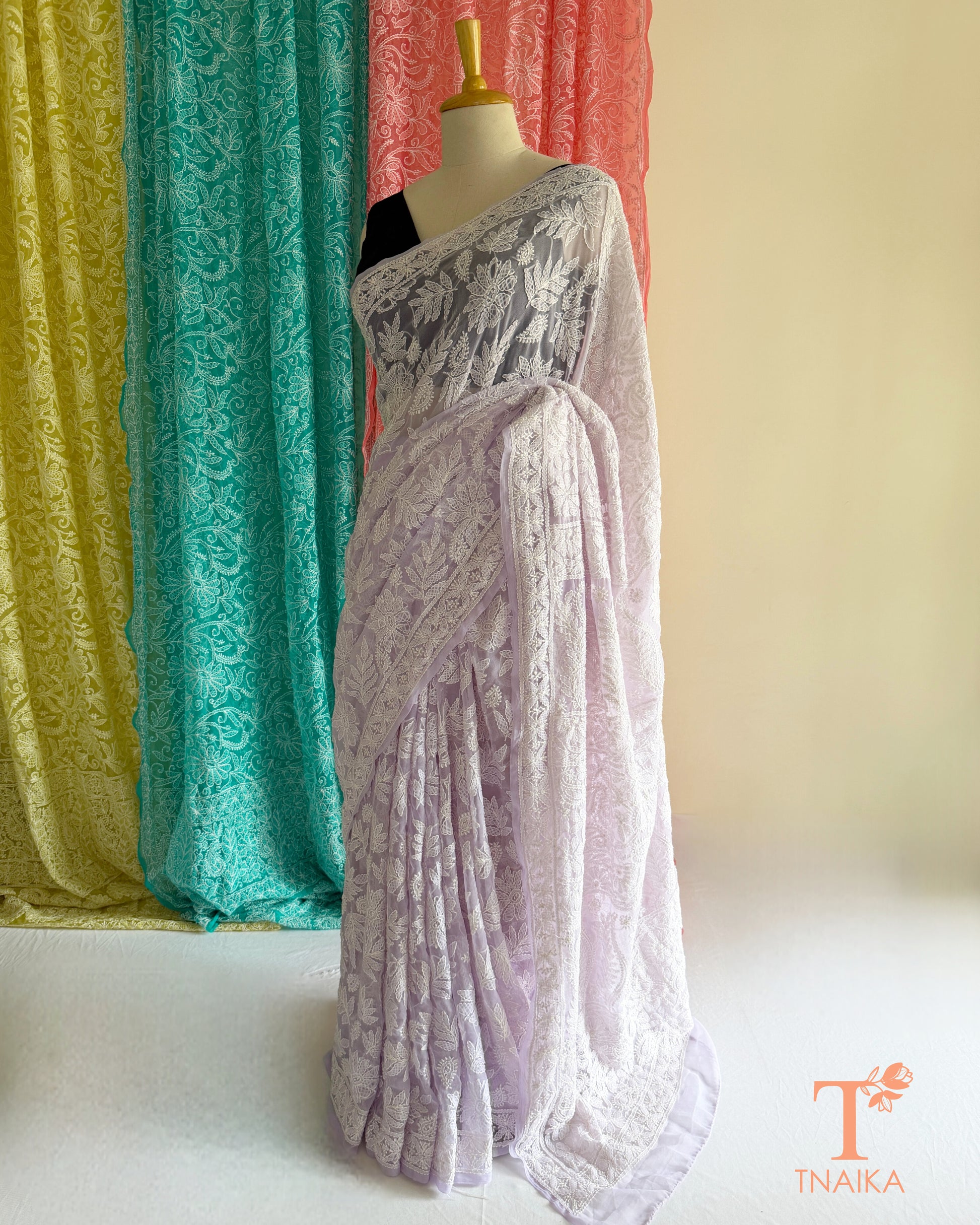 Premium Chikankari full jaal saree featuring dense traditional embroidery.