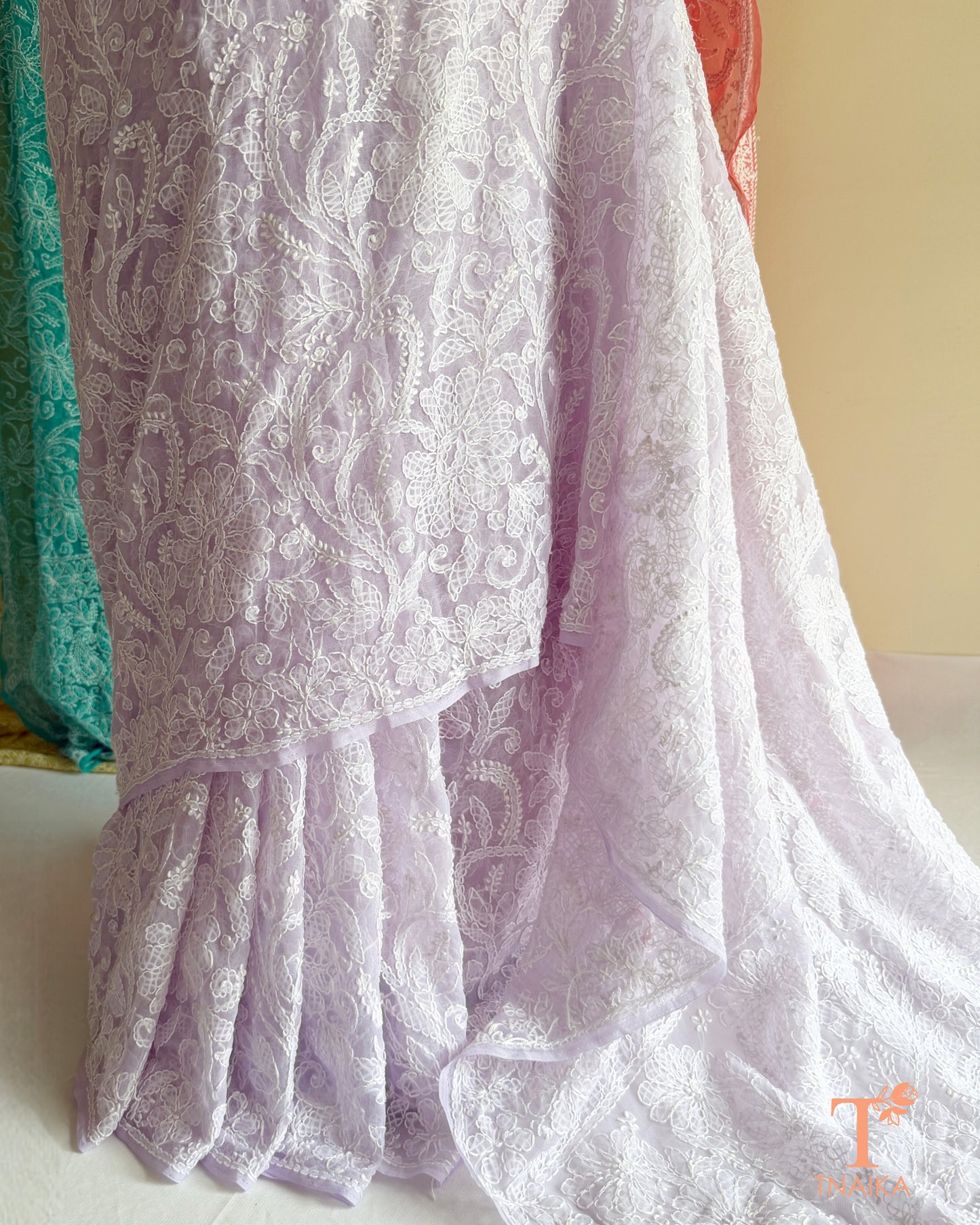 Lightweight full jaal Chikankari saree with intricate floral embroidery.