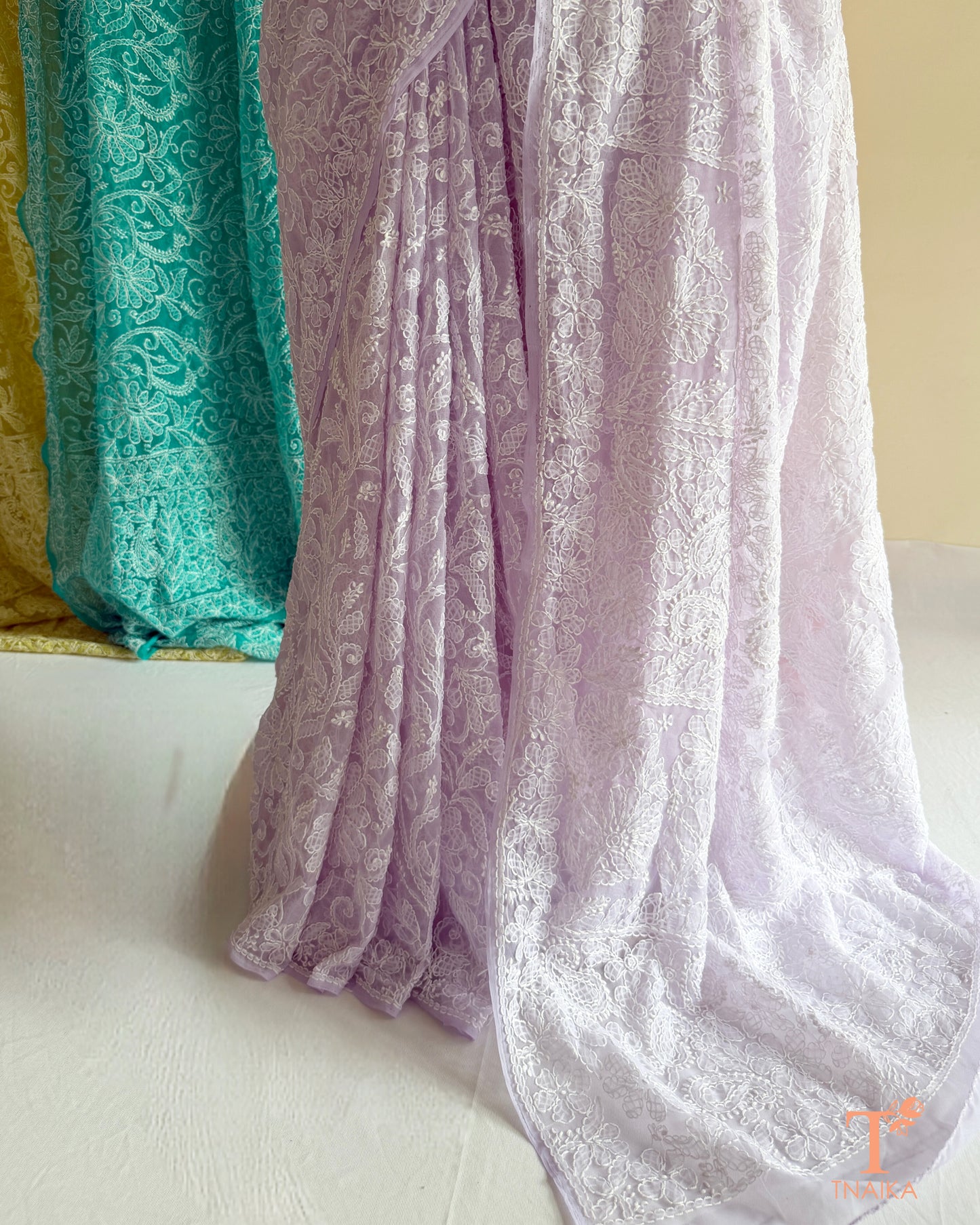 Full jaal Chikankari saree with intricate Lucknowi embroidery on soft fabric.