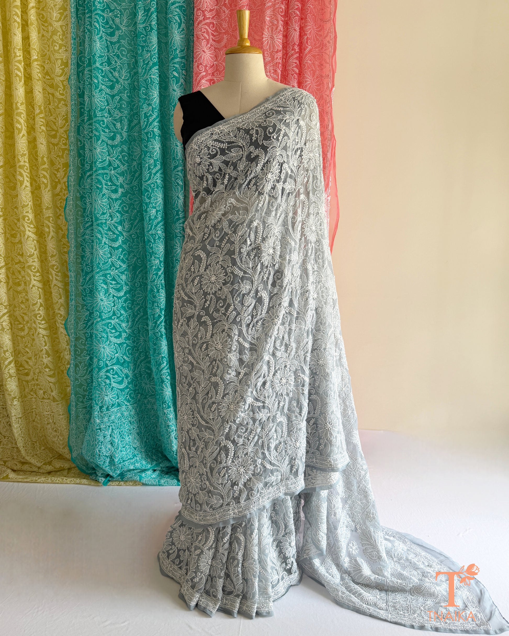 Full jaal Chikankari saree with intricate Lucknowi embroidery on soft fabric.