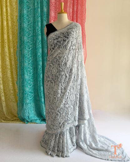 Full jaal Chikankari saree with intricate Lucknowi embroidery on soft fabric.