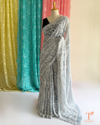 Premium Chikankari full jaal saree featuring dense traditional embroidery.