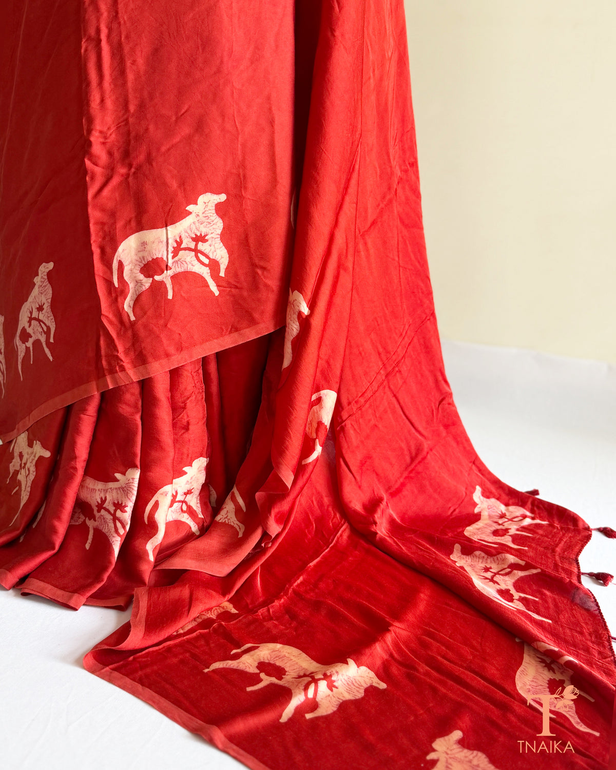 Hand-dyed modal silk saree featuring handcrafted cow motifs
