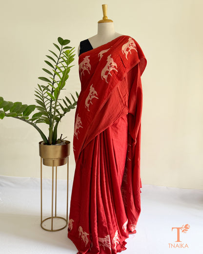 Handcrafted modal saree with intricate cow motif artwork