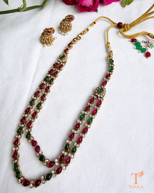 Emerald green artificial stone necklace set with matching pearl jhumki earrings.