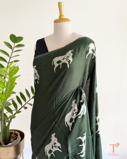 Handcrafted modal saree hand-dyed with traditional cow motifs