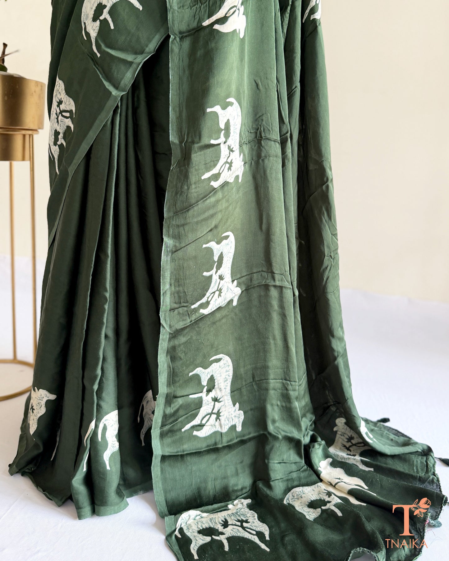 Hand-dyed modal saree showcasing unique cow motif detailing