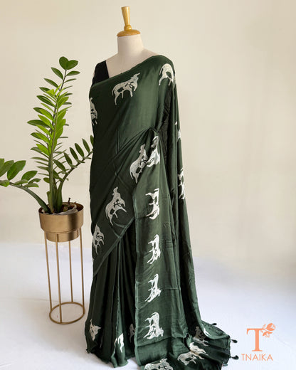 Hand-dyed modal silk saree featuring handcrafted cow motifs