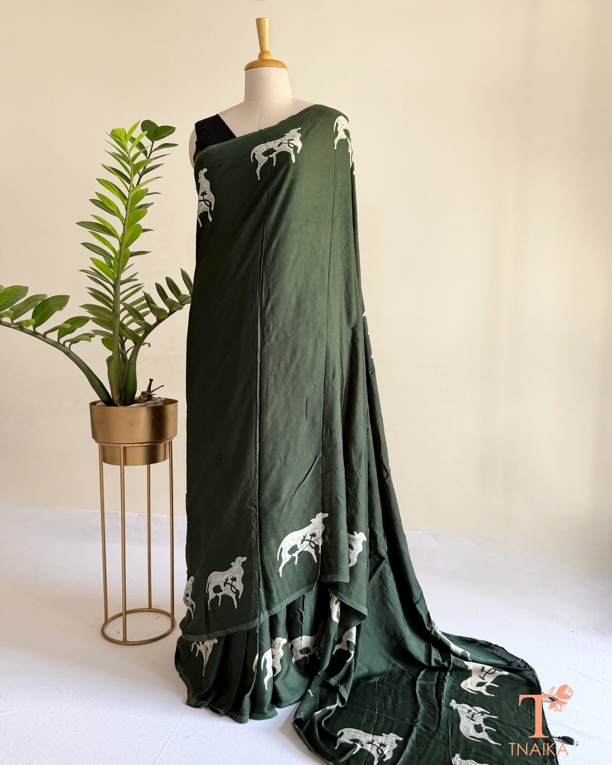 Handcrafted modal saree with intricate cow motif artwork
