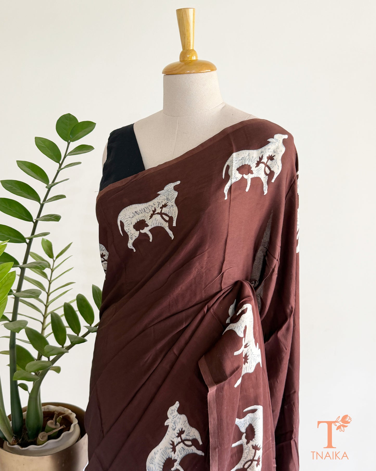 Handcrafted modal saree with intricate cow motif artwork