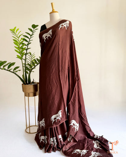 Hand-dyed modal saree showcasing unique cow motif detailing
