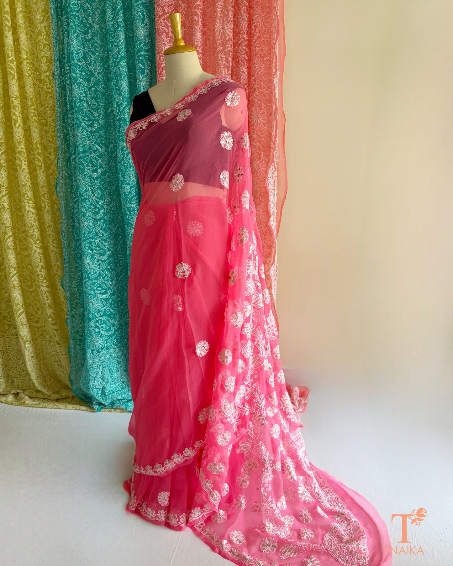Pink designer saree featuring Chikankari floral embroidery and Gotta Patti detailing
