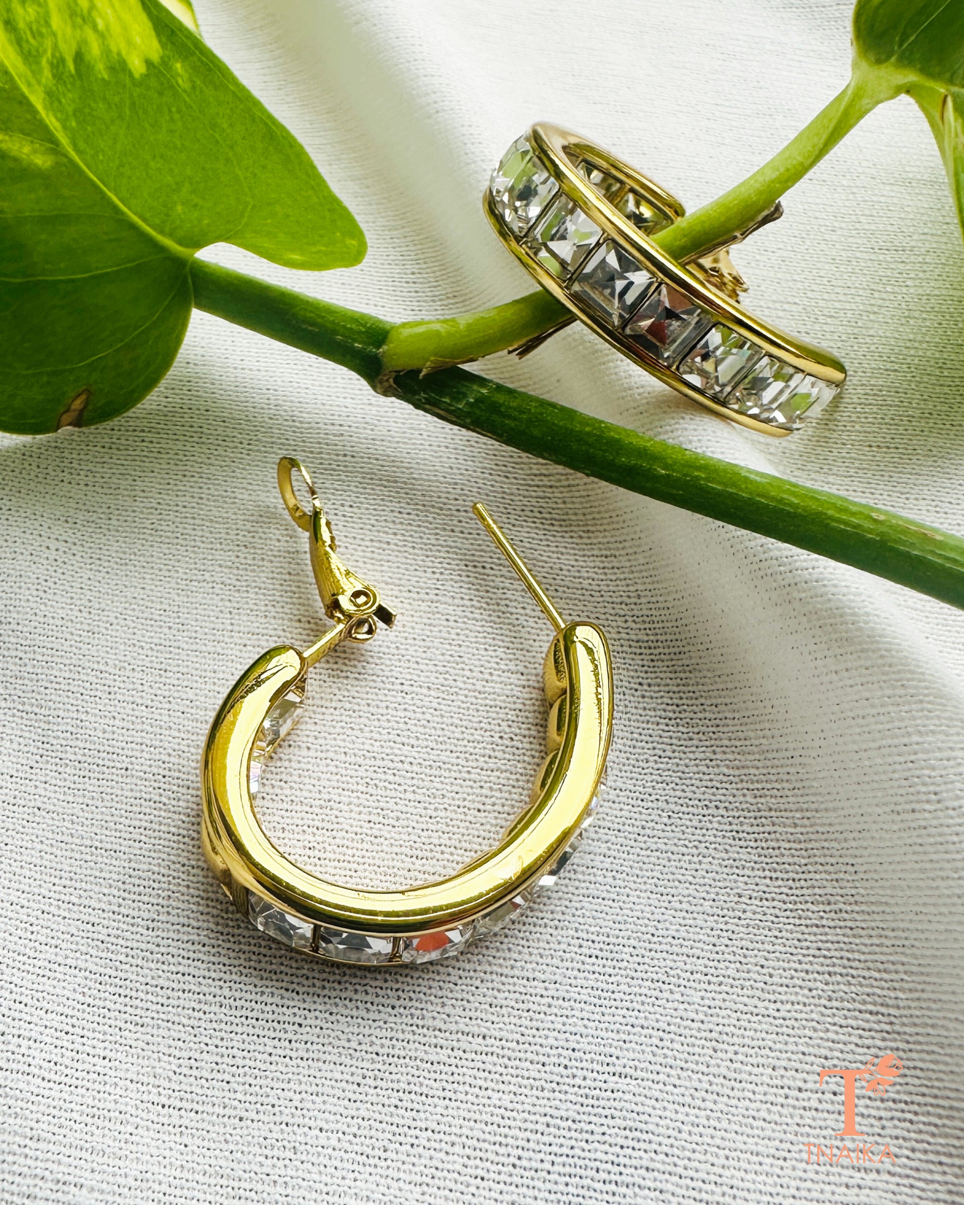 Elegant gold hoop earrings with clear crystal detailing