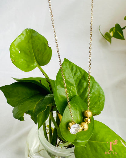 Gold tone anti-tarnish necklace with a sparkling crystal centerpiece and delicate bead detailing.