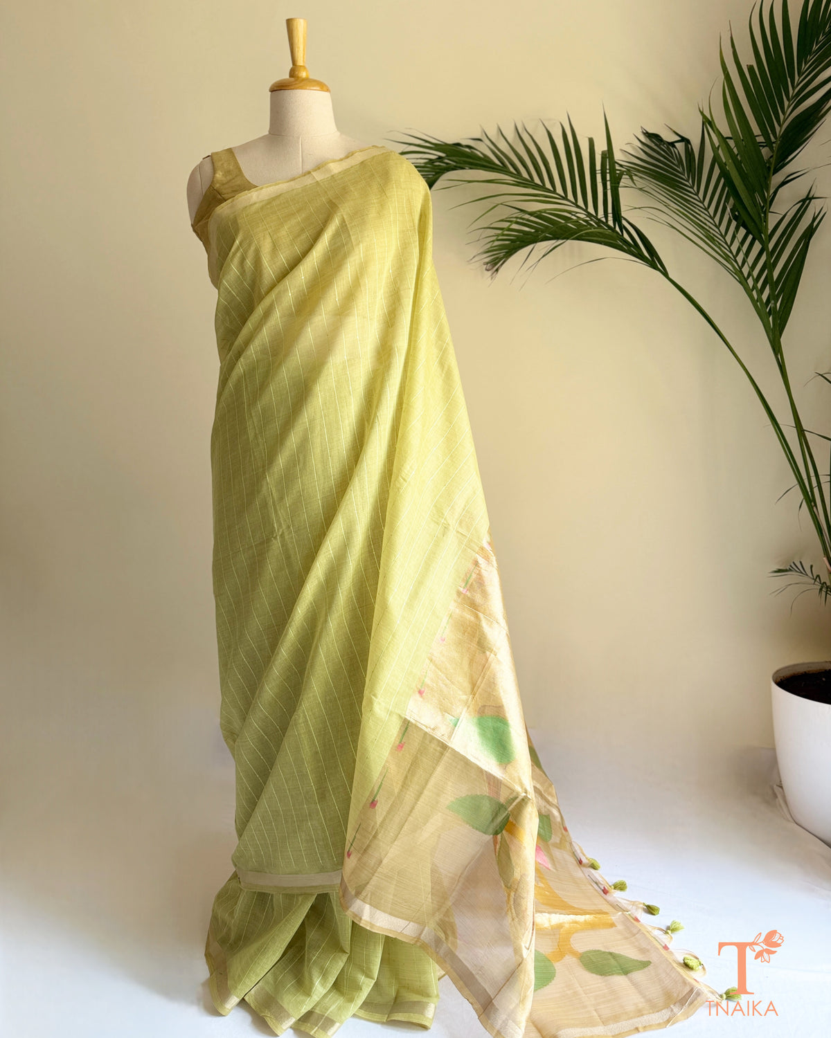 lime green cotton saree with colourful traditional-inspired pallu