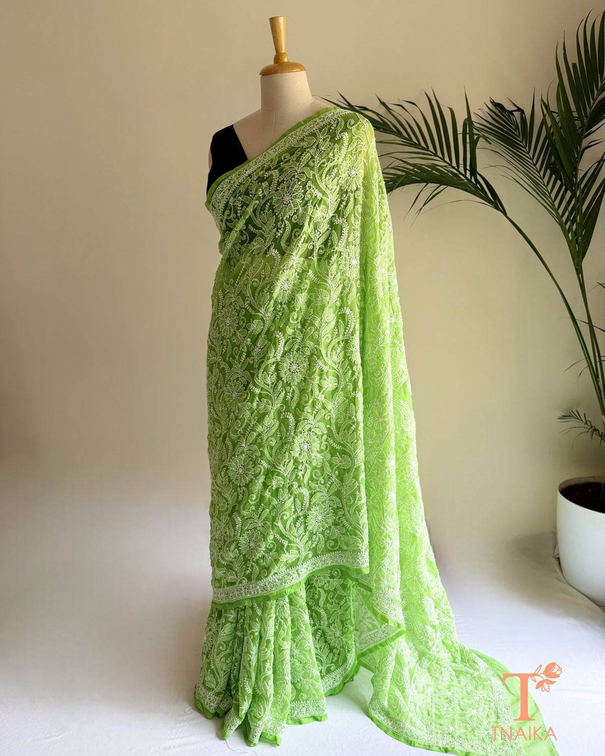 Green chikankari full jaal saree with intricate floral embroidery and detailed border