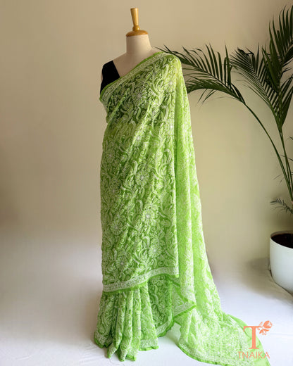 Green chikankari full jaal saree with intricate floral embroidery and detailed border