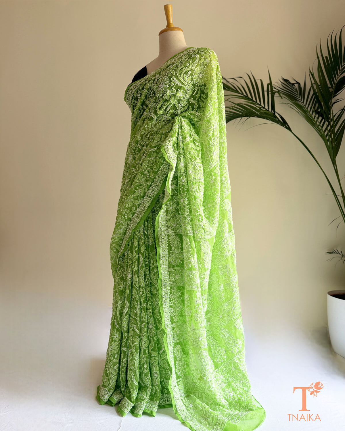 Green chikankari full jaal saree with delicate floral embroidery and embroidered pallu