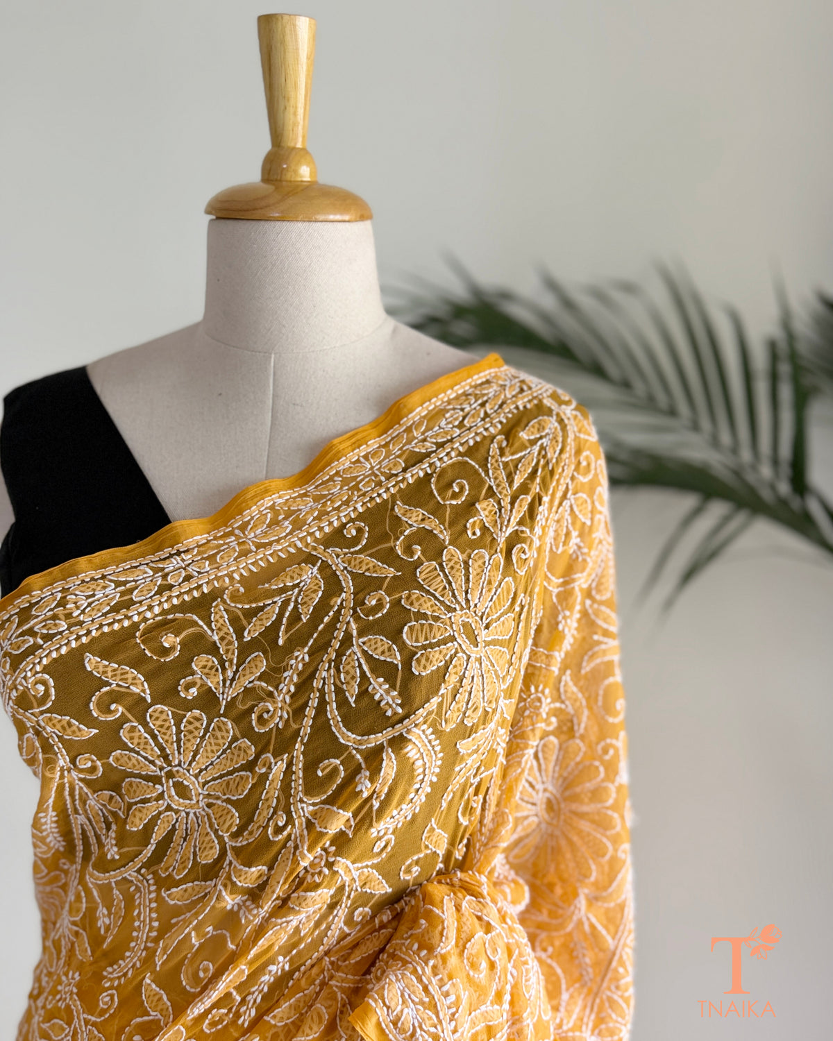 Handcrafted Lucknowi Chikankari saree in mustard yellow georgette.