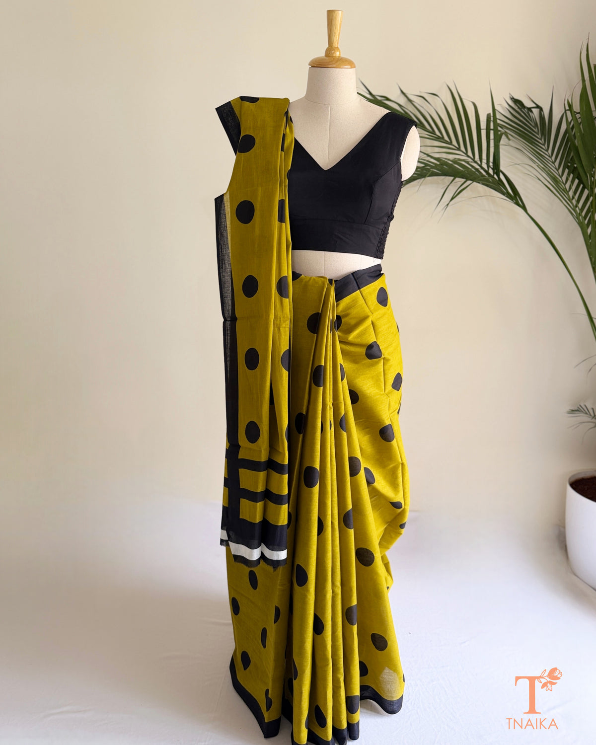 Elegant cotton saree with classic polka dot prints, designed for comfortable everyday wear