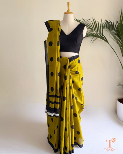 Elegant cotton saree with classic polka dot prints, designed for comfortable everyday wear